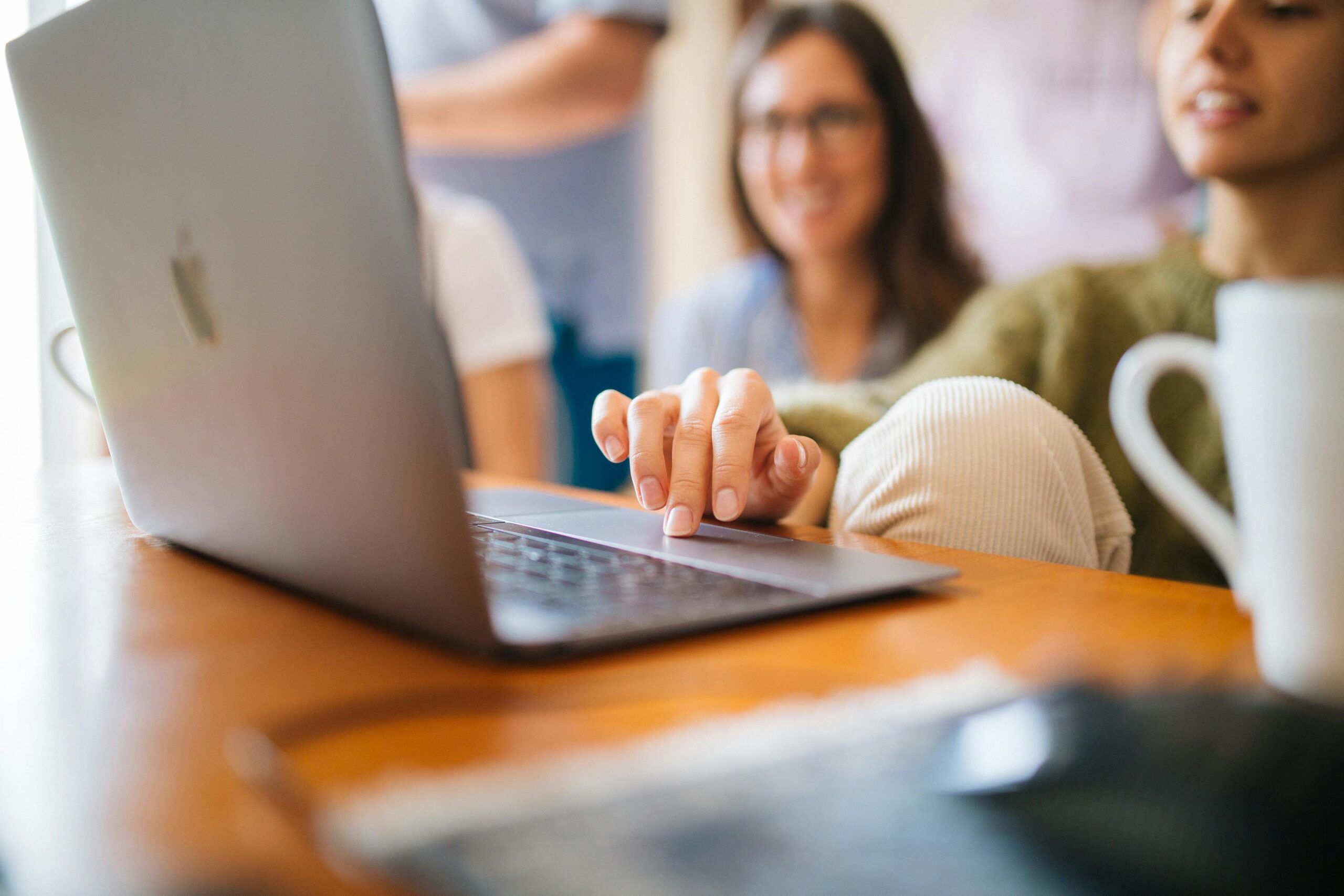 Close up photo of woman using laptop